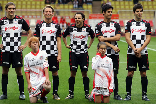 Formula One drivers line up before the Monaco All Stars soccer match