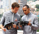 Jenson Button and Lewis Hamilton examine their special Steinmetz diamond encrusted steering wheels