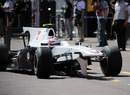 Kamui Kobayashi returns to the pits with a broken wing