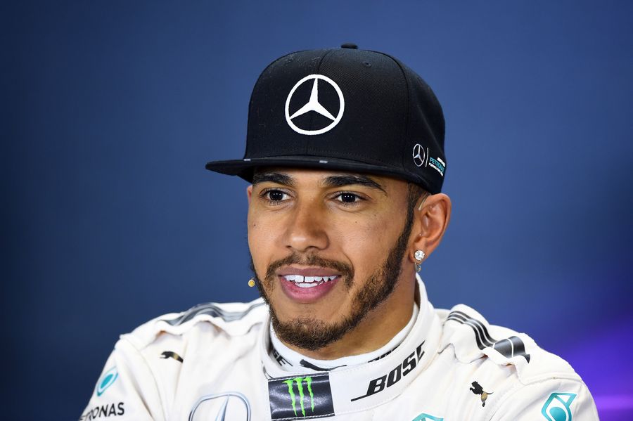 Lewis Hamilton enjoys the moment during the press conference after qualifying