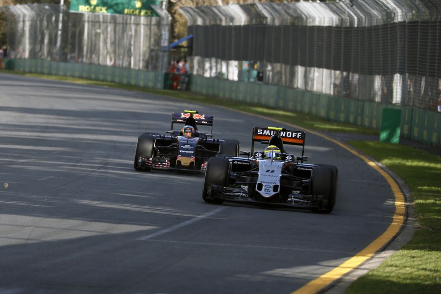 Sergio Perez defends his position from Carlos Sainz
