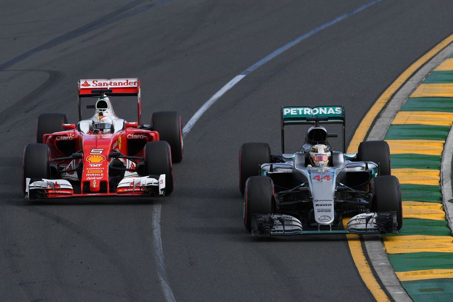 Lewis Hamilton battles for a positon with Sebastian Vettel