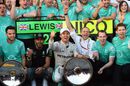 Lewis Hamilton and Nico Rosberg celebrate Mercedes' 1-2 finish with the team