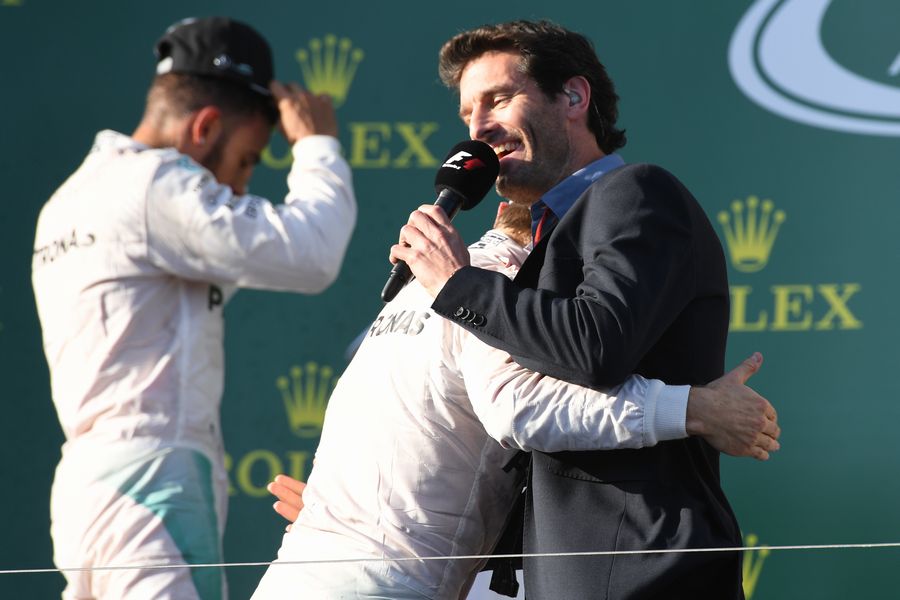 Nico Rosberg and Mark Webber celebrate on the podium