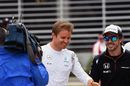 Nico Rosberg greets Fernando Alonso