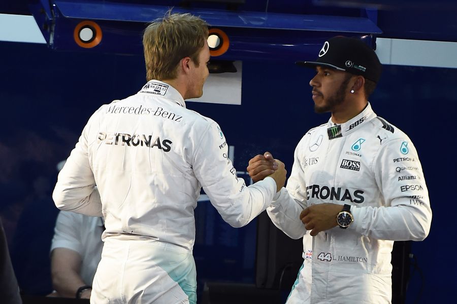 Lewis Hamilton celebrates with Nico Rosberg