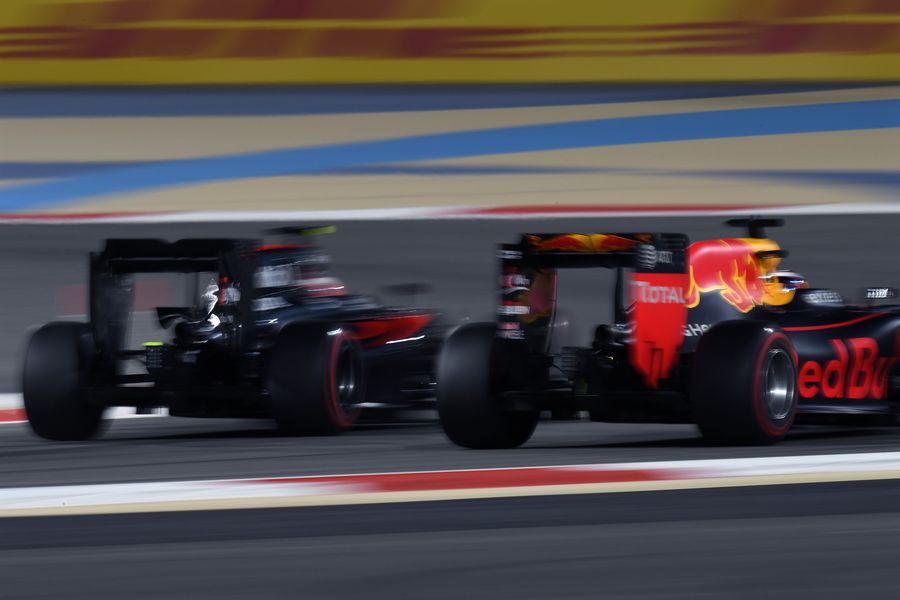 Daniel Ricciardo fights a position with Jenson Button