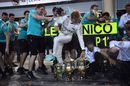 Mercedes mechanics celebrate Nico Rosberg