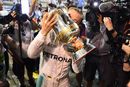 Nico Rosberg celebrates with the trophy