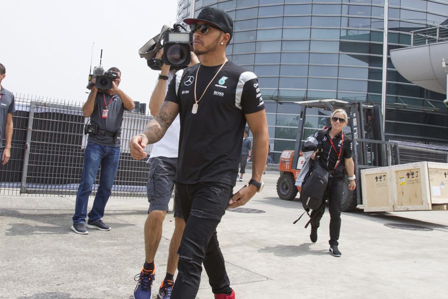 Lewis Hamilton arrives at the paddock