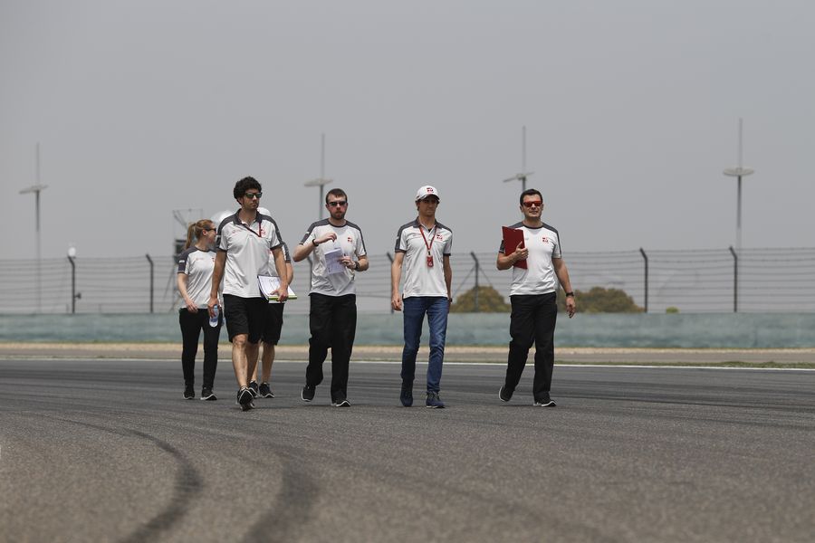Esteban Gutierre walks the track with his engineers