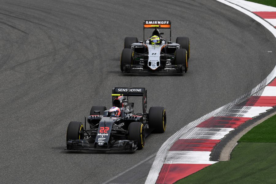 Jenson Button leads Sergio Perez