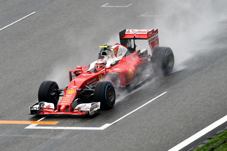 Kimi Raikkonen at speed on wet track