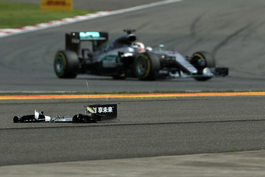 Lewis Hamilton passes his front wing debris on the track