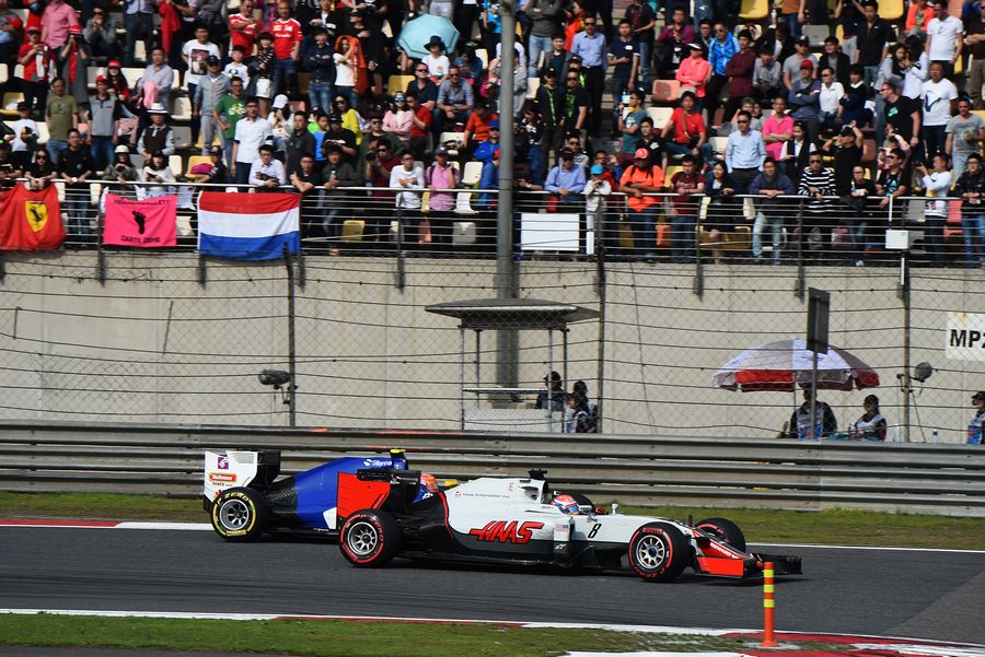 Romain Grosjean battles a position with Felipe Nasr