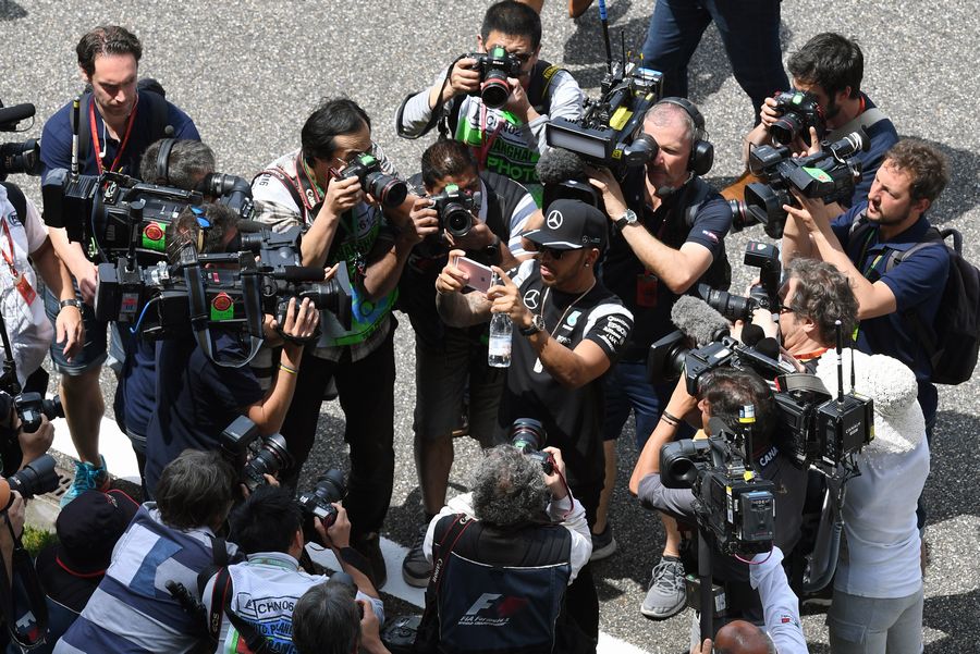 Lewis Hamilton and photographers on the drivers parade