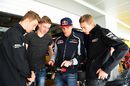 Max Verstappen explains his steering wheel to guests