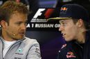 Nico Rosberg speaks with Daniil Kyvat during the press conference