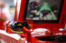 Fernando Alonso watches Tonio Liuzzi's on-board lap