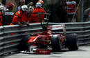 Fernando Alonso's Ferrari sits in the barrier after crashing in Casino Square 