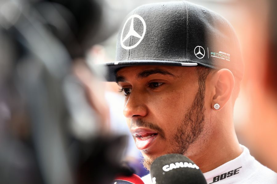 Lewis Hamilton talks with media after a disappointing qualifying