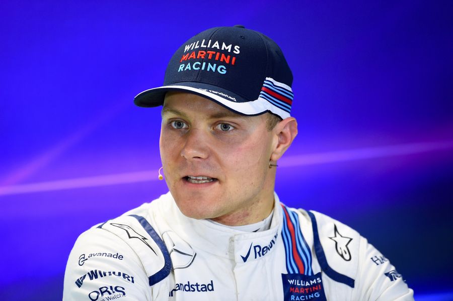 Valtteri Bottas answers a question from media