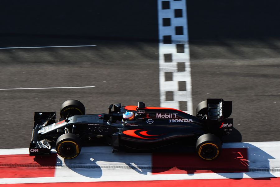 Fernando Alonso works hard to keep the pace in the McLaren