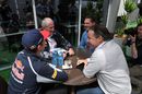 Max Verstappen talks to Helmut Marko with his father Jos and his manager