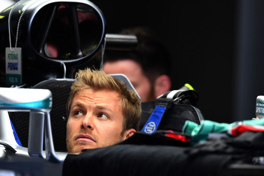 Nico Rosberg sits in the Mercedes cockpit in the garage