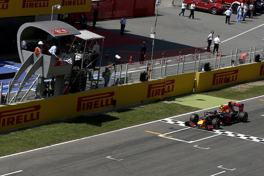 Race winner Max Verstappen crosses the line