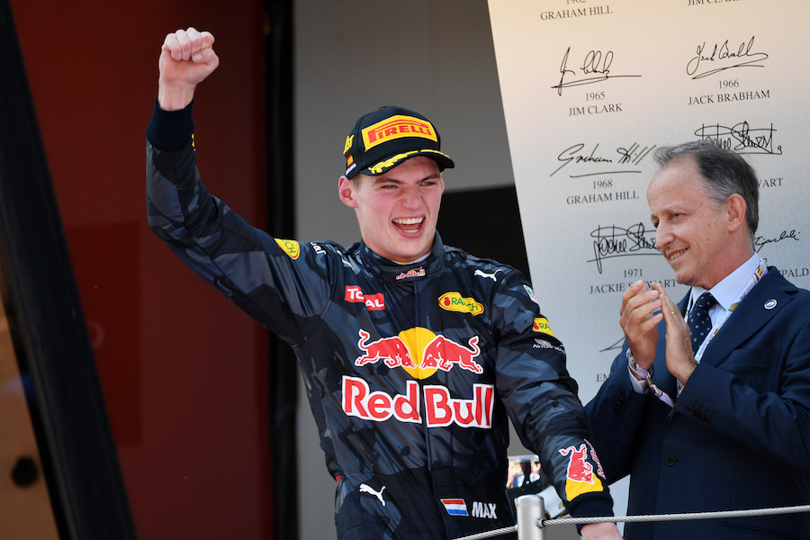 Max Verstappen celebrates his first win in podium