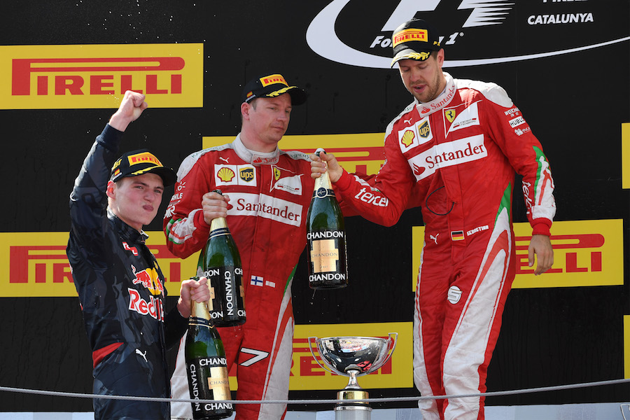 Kimi Raikkonen and Sebastian Vettel celebrate on the podium