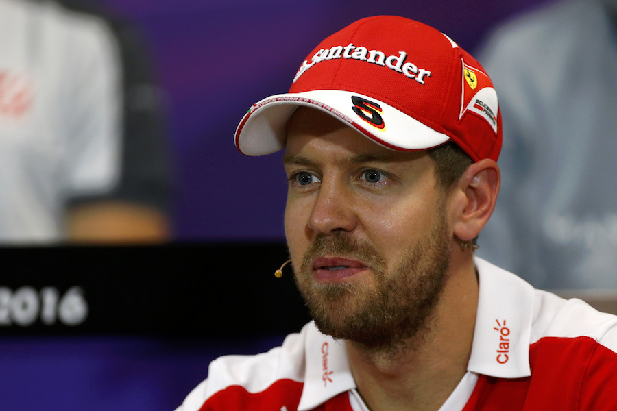 Sebastian Vettel talks to media in the press conference