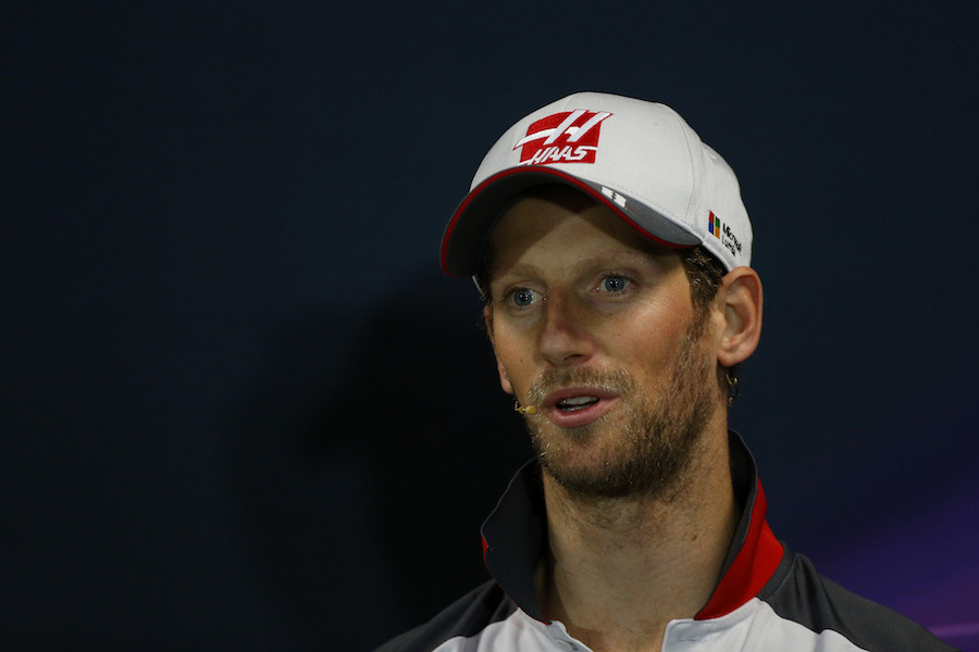 Romain Grosjean talks to the press at the press conference