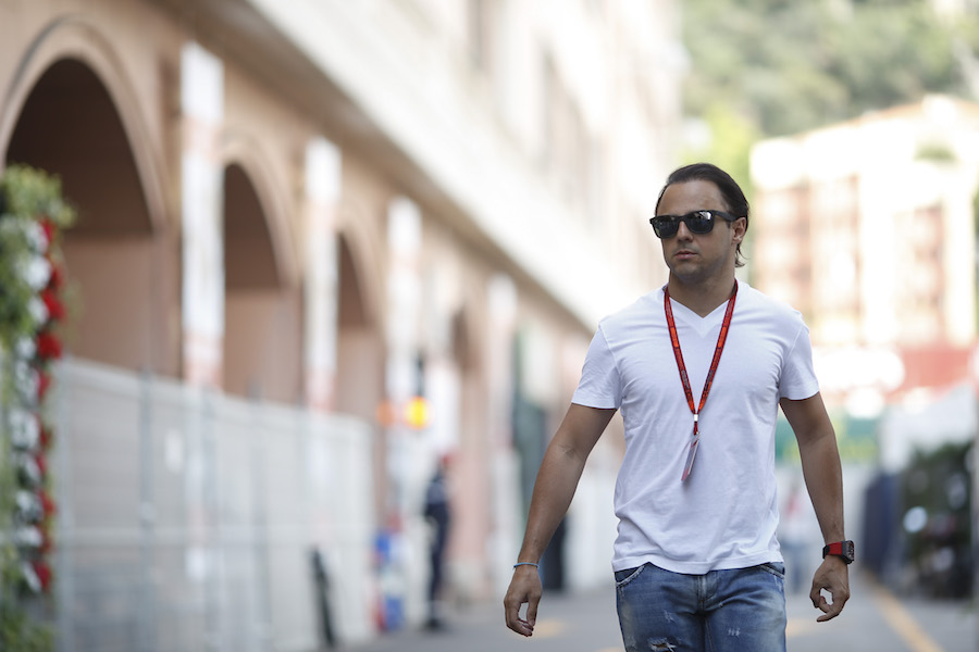 Felipe Massa walks through the paddock 