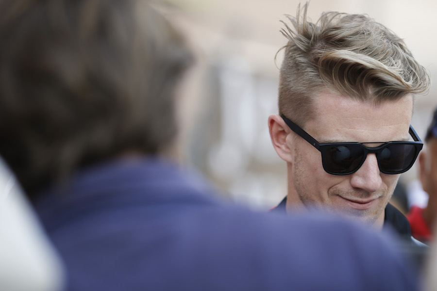 Nico Hulkenberg signs an autograph for fans