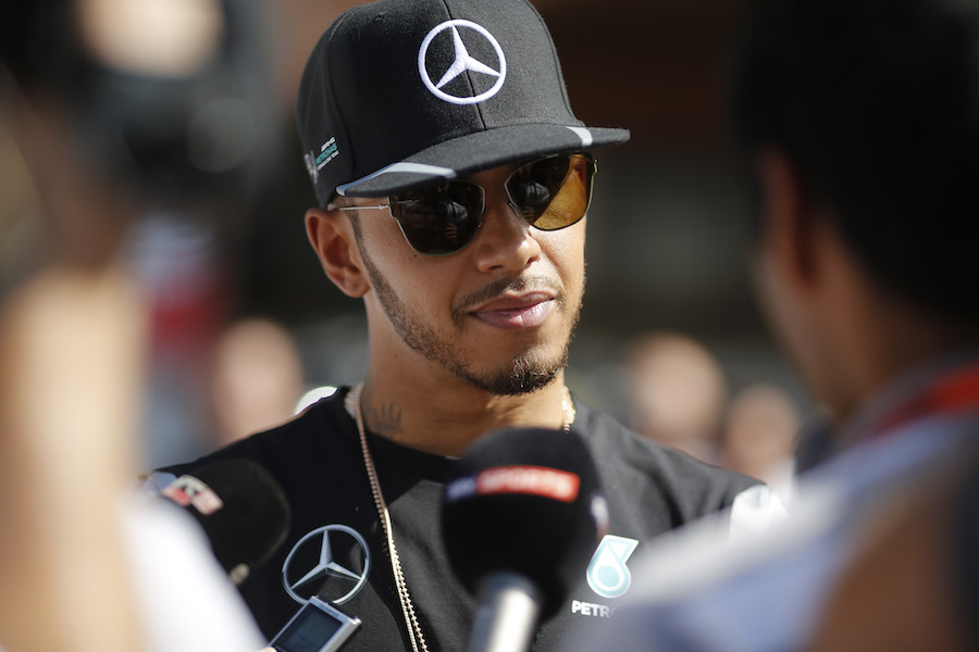 Lewis Hamilton talks with the media