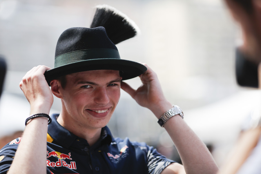 Max Verstappen poses with wearing a hat