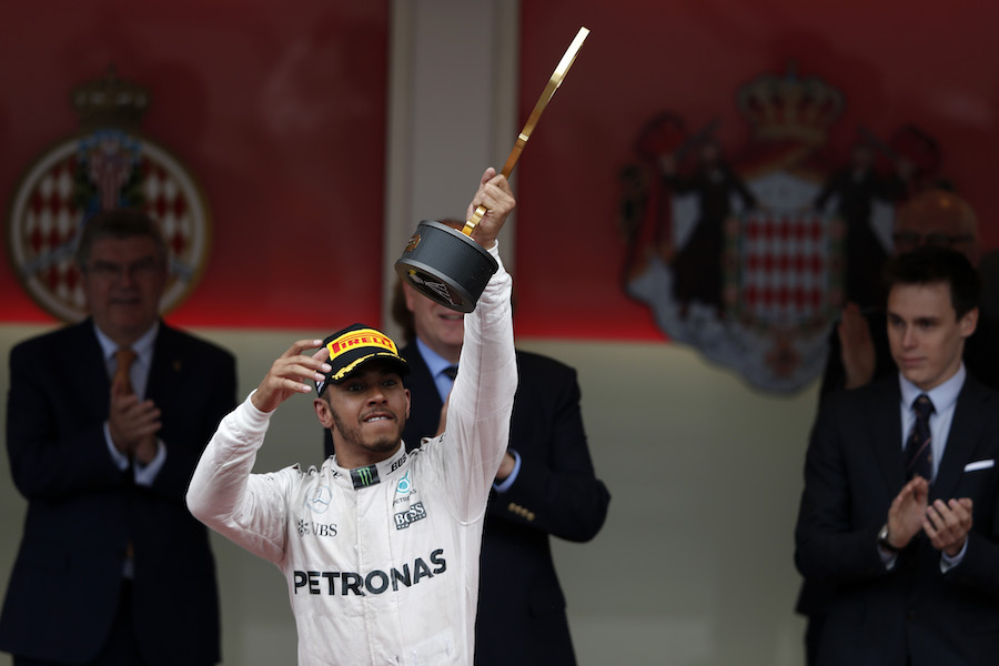Lewis Hamilton celebrates his victory on the podium