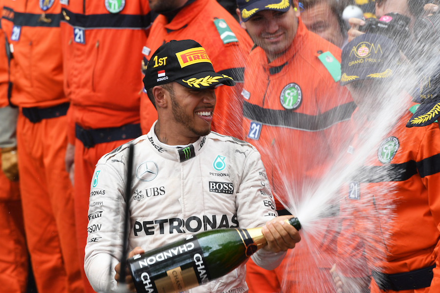 Lewis Hamilton cerebrates with champagne
