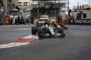 Lewis Hamilton runs wide in front of Daniel Ricciardo