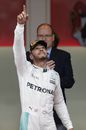 Lewis Hamilton celebrates on the podium for his Monaco win