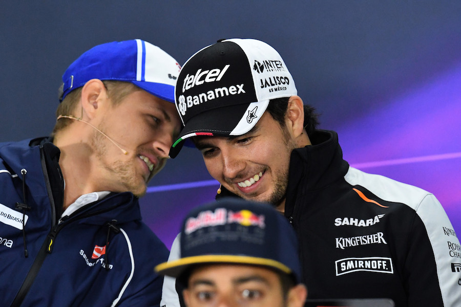 Marcus Ericsson speaks with Sergio Perez during the press conference
