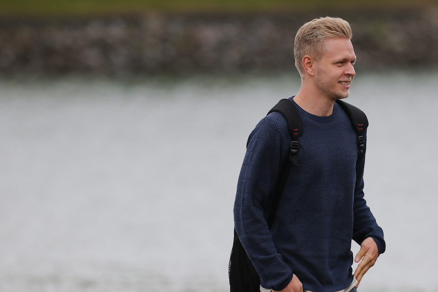 Kevin Magnussen walks to the paddock