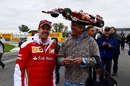 Sebastian Vettel poses with a fan