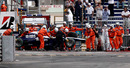 Race marshalls clear the car of Williams' Nico Hulkenberg