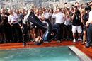 Mark Webber backflips into the team pool