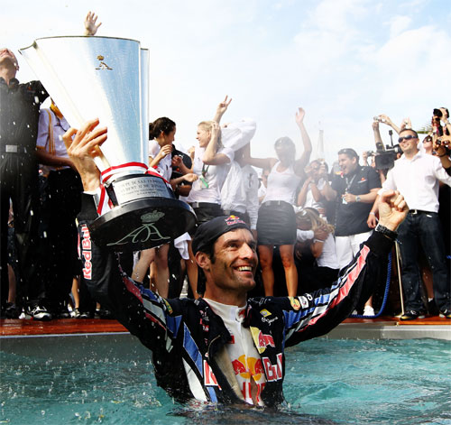 Mark Webber celebrates his win in the Red Bull swimming pool