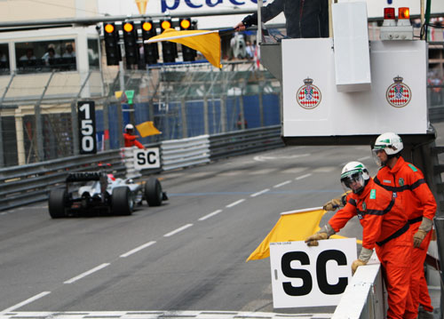 Michael Schumacher makes sedate progress under the yellow flag