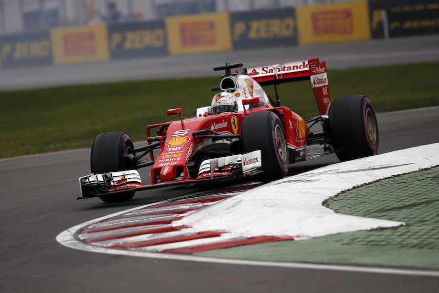 Sebastian Vettel works hard to keep his pace